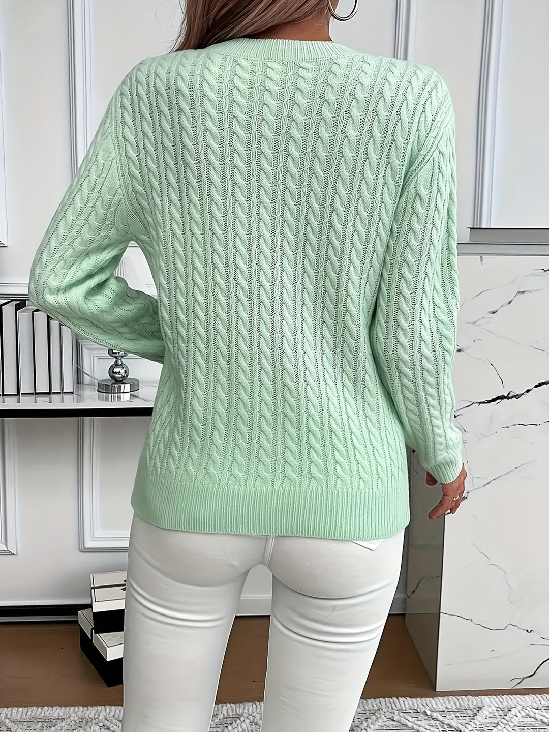 Stylish women's cable knit sweater, soft & cozy. Perfect long-sleeve, round neck top for spring and autumn.