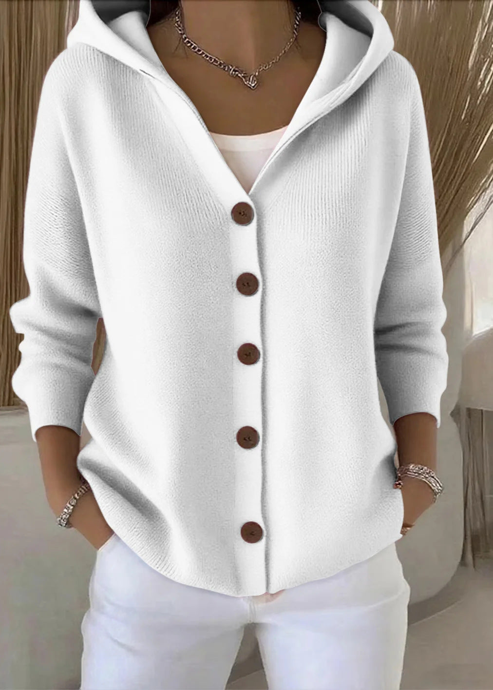 Versatile long-sleeve women's hooded cardigan made from soft cotton material.