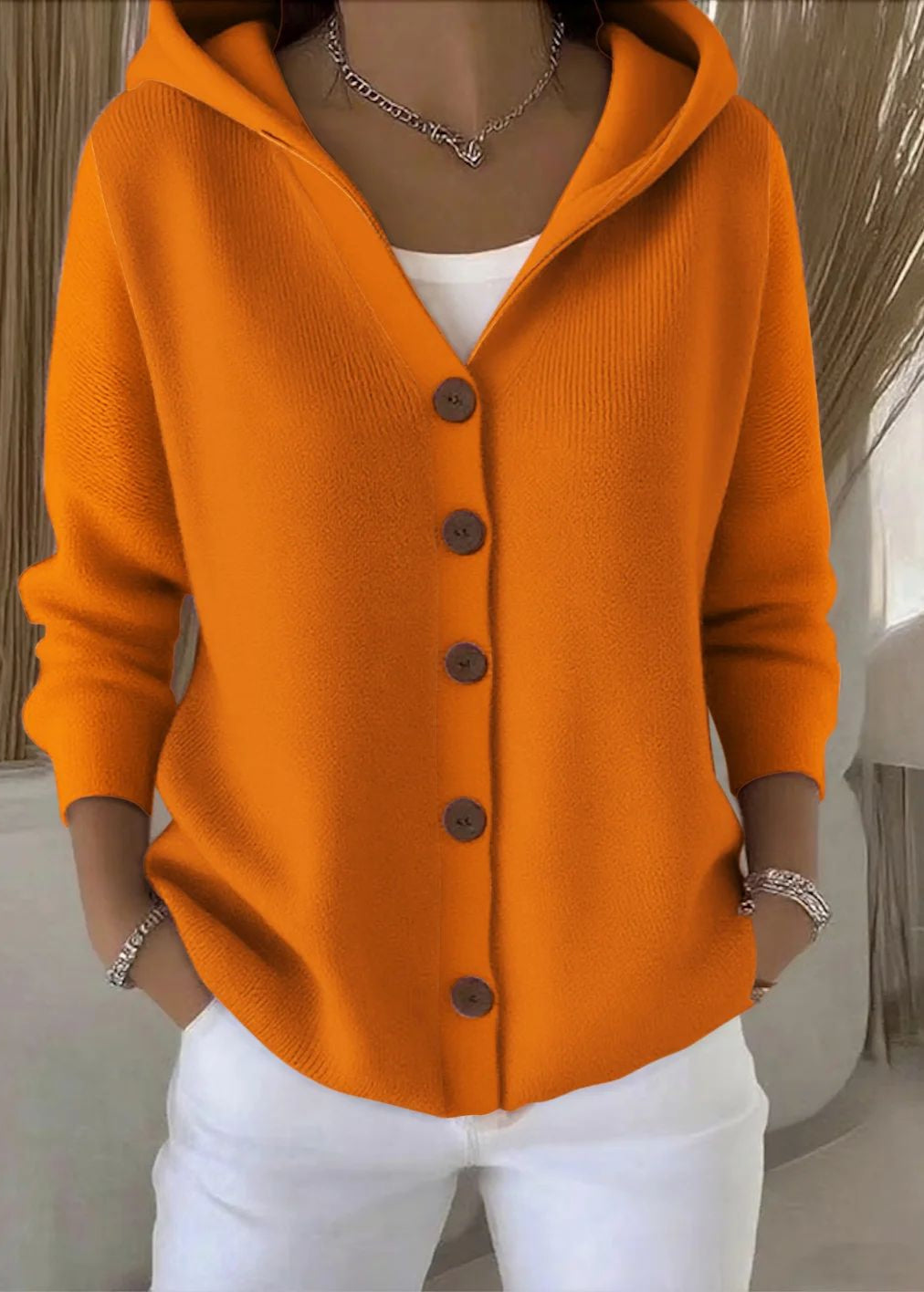 Casual women's cotton knit hooded cardigan, a cozy and stylish layering piece.