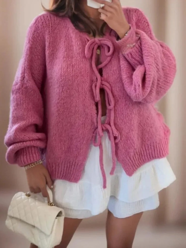 Feminine fashion women's knit cardigan with stylish bow ties, offering cozy and lightweight comfort.