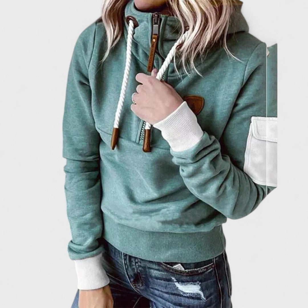 Close-up of a women's ivory soft knit jumper featuring a stylish zip neck pullover detail