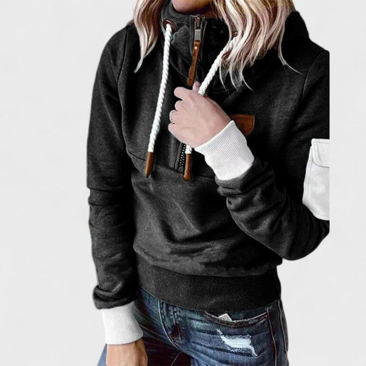 Folded women's soft knit pullover, light blue with zip neck, ideal for casual and comfortable wear