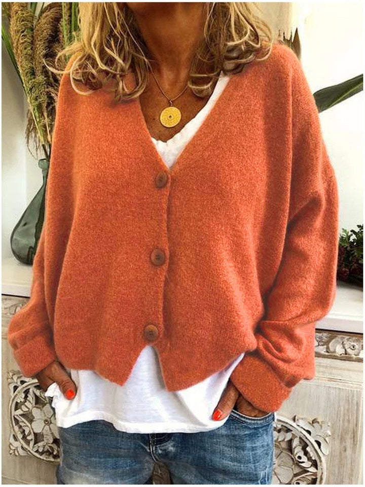 Chic women's knit cardigan sweater in a neutral hue, ideal for effortless layered fall fashion.