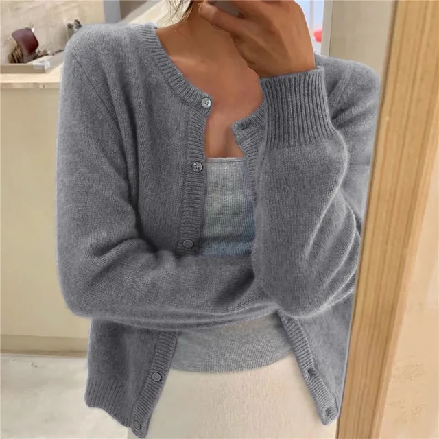 Women's soft knit relaxed fit button-up cardigan in cream, perfect for casual layering.