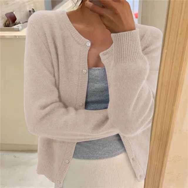 Close-up of a women's button-up cardigan, showcasing the soft knit texture and relaxed fit.