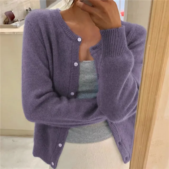 Stylish women's relaxed fit knit cardigan, buttoned up, suitable for everyday casual wear.