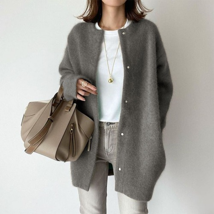 Close-up of the soft knit texture of a women's relaxed fit long cardigan, emphasizing comfort.