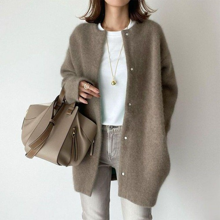 Stylish women's long sweater in a relaxed fit, featuring buttons, suitable for fall fashion.