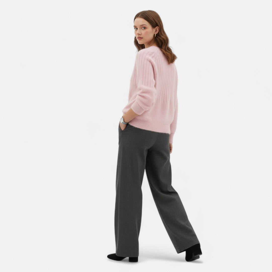 Fashionable women's knit sweater, soft pullover offering comfort & timeless elegance.