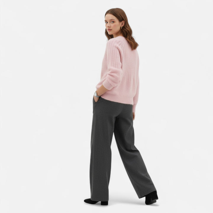 Fashionable women's knit sweater, soft pullover offering comfort & timeless elegance.