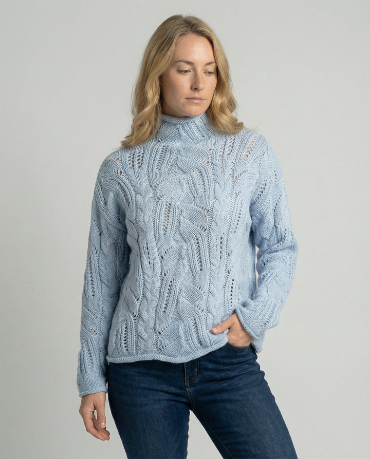 Women's soft luxury knit sweater, minimalist design for elegant everyday comfort. Classic long sleeve winter top.
