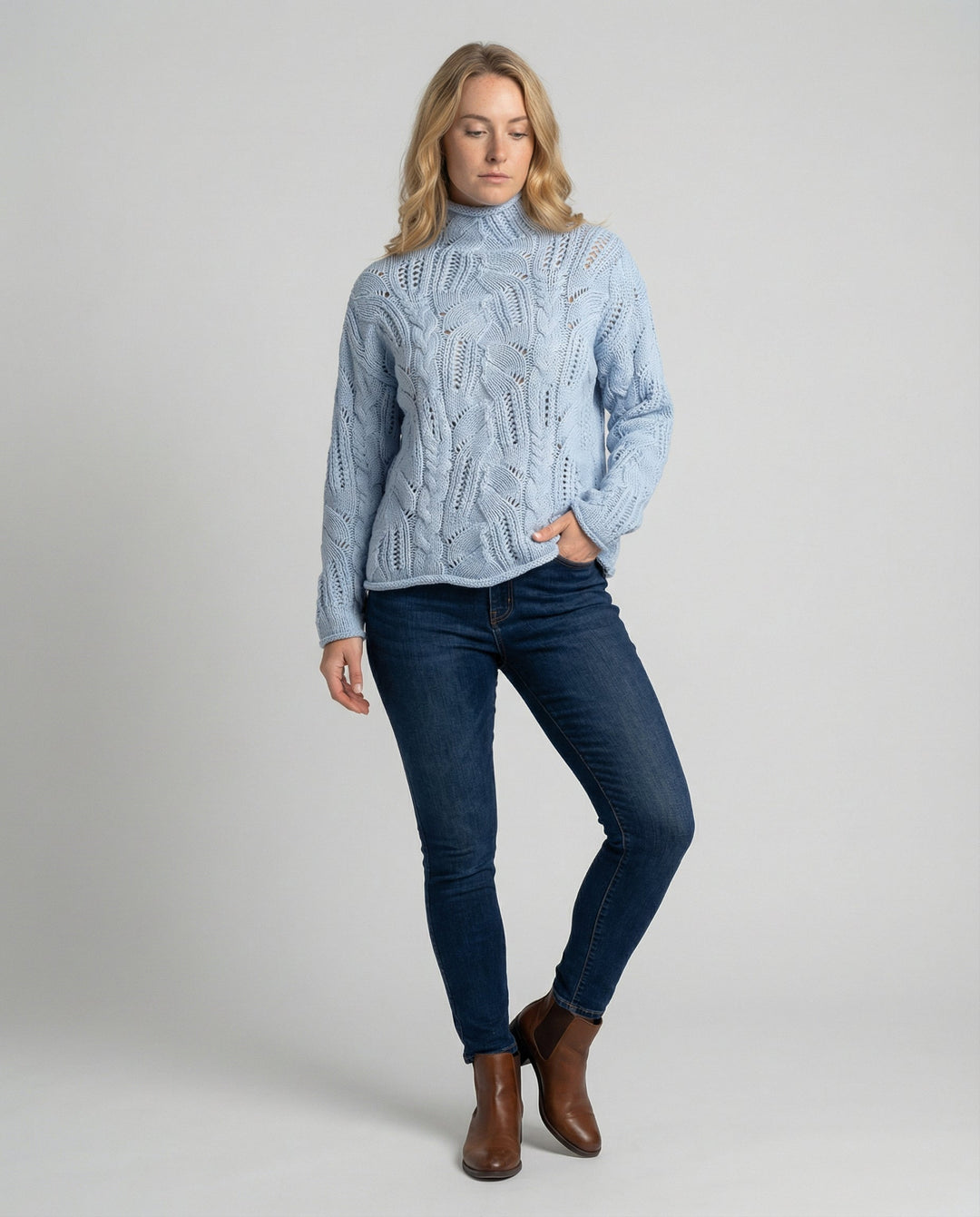 Minimalist women's luxury knit sweater, soft for versatile everyday comfort. Elegant long sleeve winter apparel.