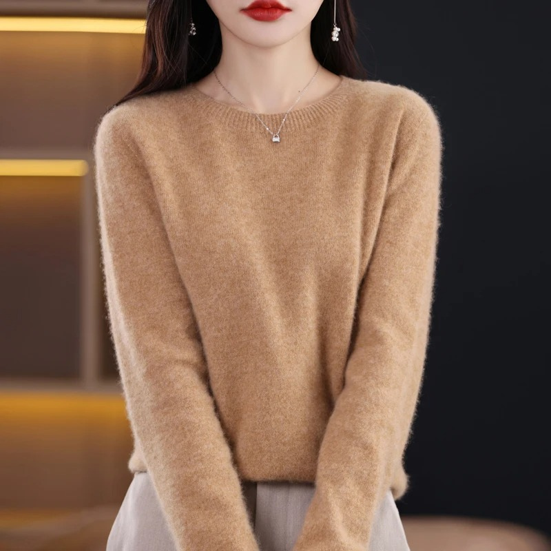 Women's soft luxury knit sweater. Warm round neck long sleeve for elegant winter fashion.