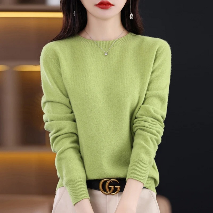 Soft touch women's luxury round neck sweater. Warm knitwear, elegant long sleeve for winter comfort.