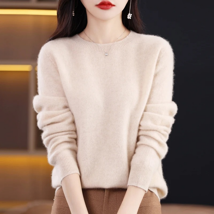 Cozy women's long sleeve round neck sweater. Warm luxury knit, perfect for elegant winter fashion.
