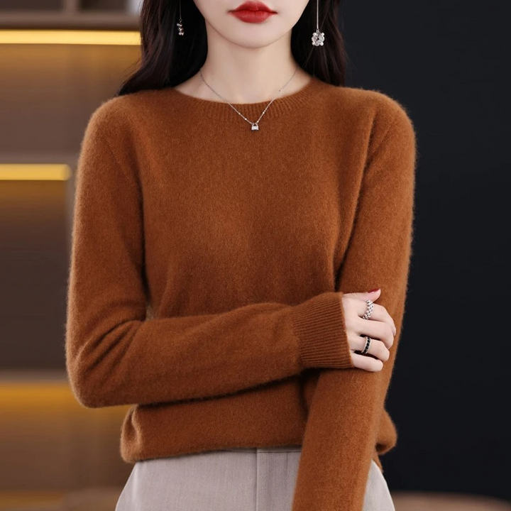 Women's comfortable crew neck knit sweater. Soft luxury material, warm for elegant winter wear.