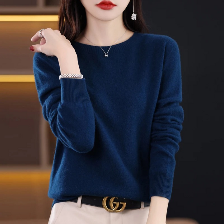 Luxurious women's soft knit round neck sweater. Warm long sleeve, ideal for elegant winter comfort.