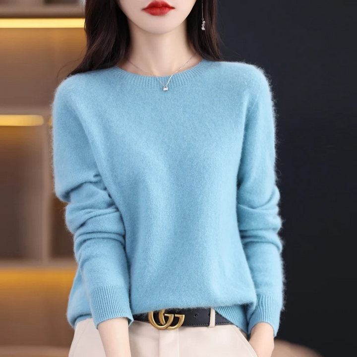 Comfortable women's warm knit round neck sweater. Soft luxury top for stylish winter wear.