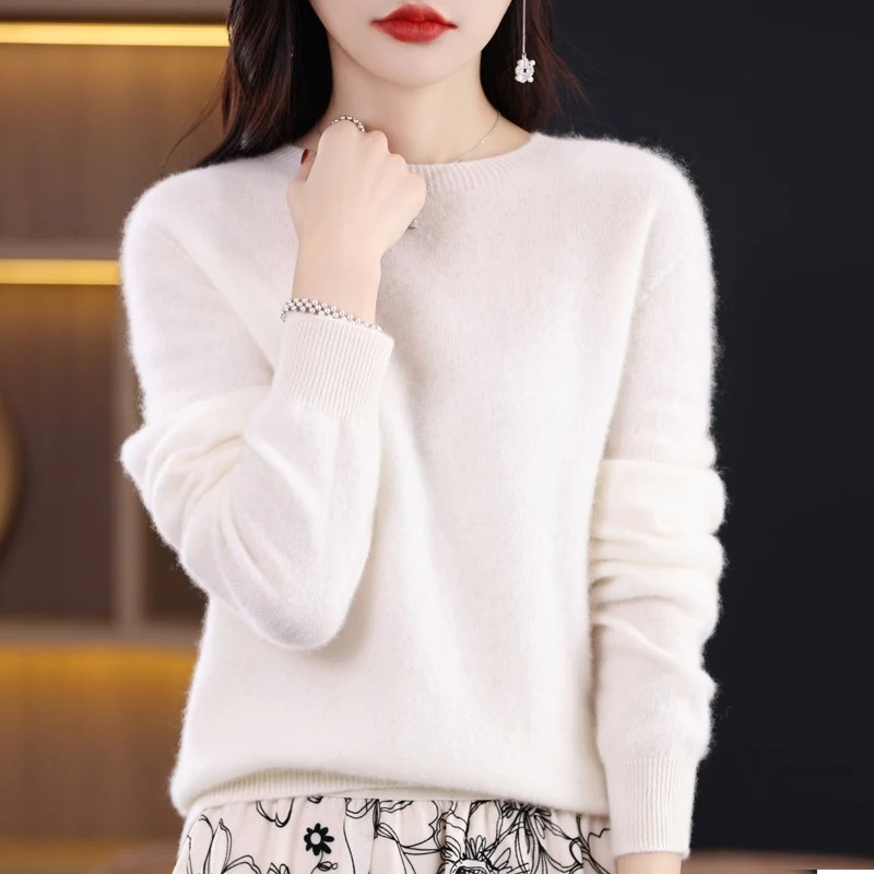 Elegant women's long sleeve luxury knit sweater. Soft, warm round neck for comfortable winter fashion.