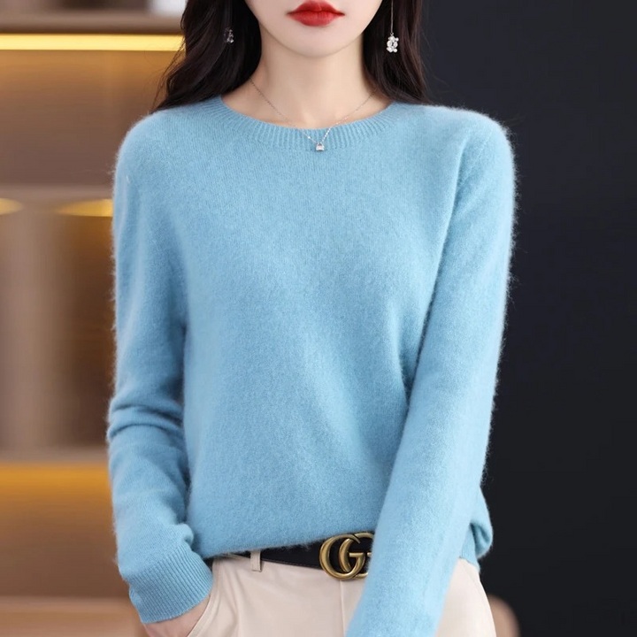 Classic women's warm knit round neck sweater. Soft, luxurious long sleeve top for elegant winter style.