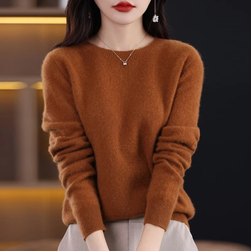 Luxury women's warm knit round neck sweater. Soft, comfortable long sleeve for elegant winter fashion.