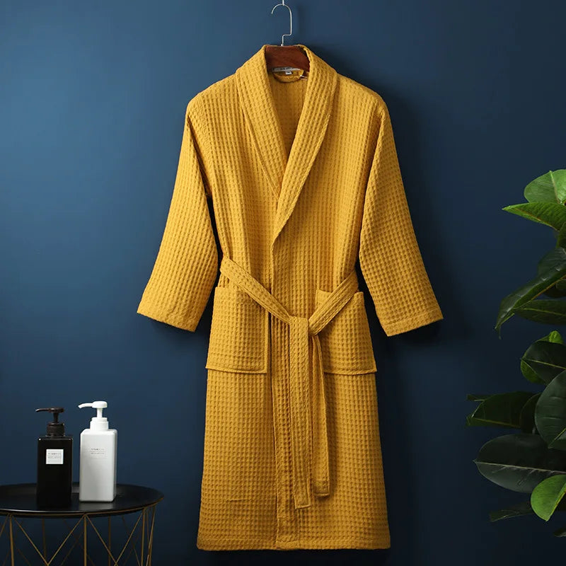 Soft peach women's waffle robe, an essential for comfortable spring lounge wear and home relaxation.