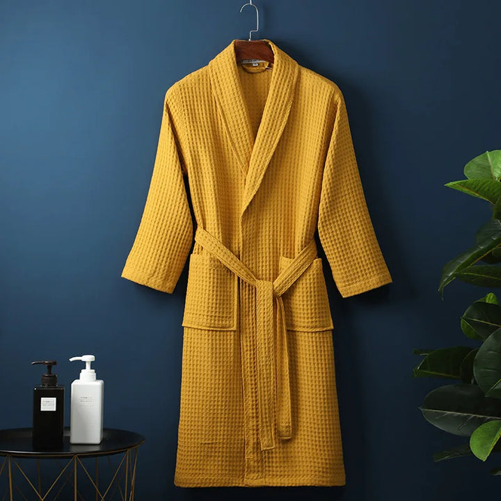 Soft peach women's waffle robe, an essential for comfortable spring lounge wear and home relaxation.