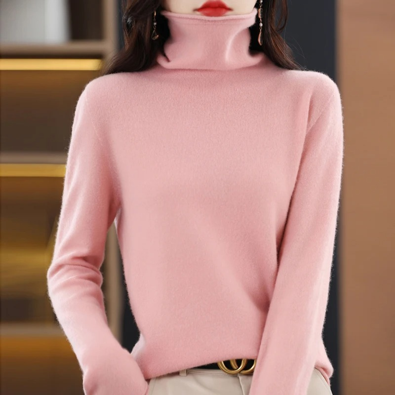 Ladies' cozy knit sweater, a comfortable roll neck staple for cool weather.