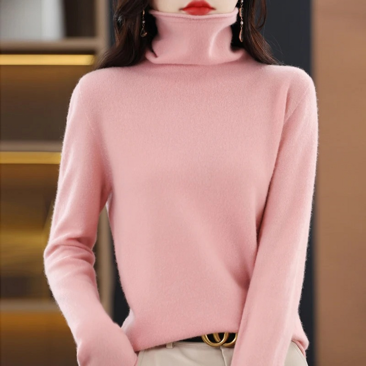 Ladies' cozy knit sweater, a comfortable roll neck staple for cool weather.