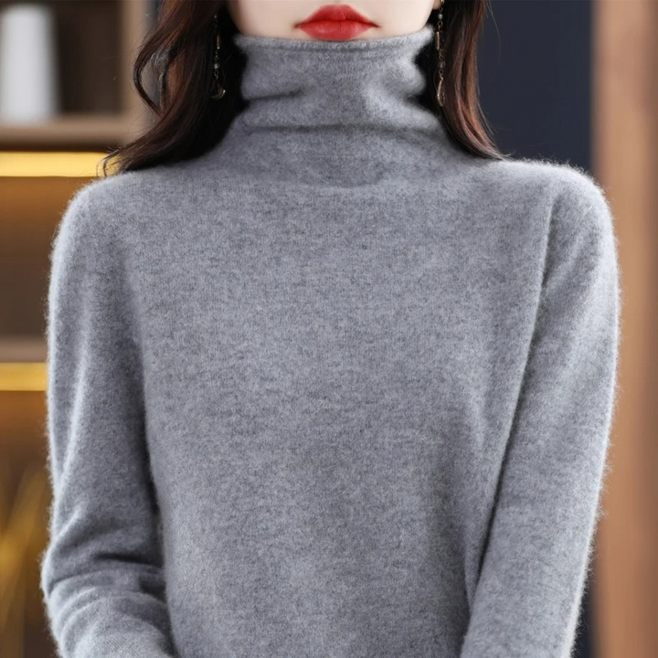 Stylish women's soft pullover, with a flattering roll neck for versatile looks.