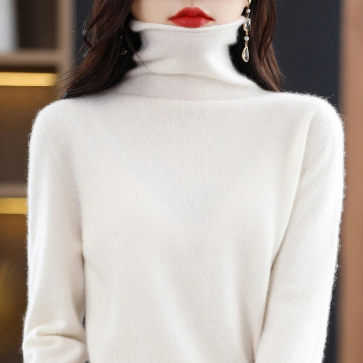 Warm women's long sleeve roll neck sweater, perfect for sophisticated comfort.