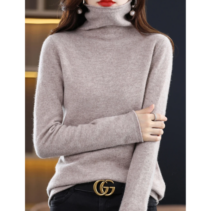Warm & comfortable women's soft knit sweater with a high roll neck.