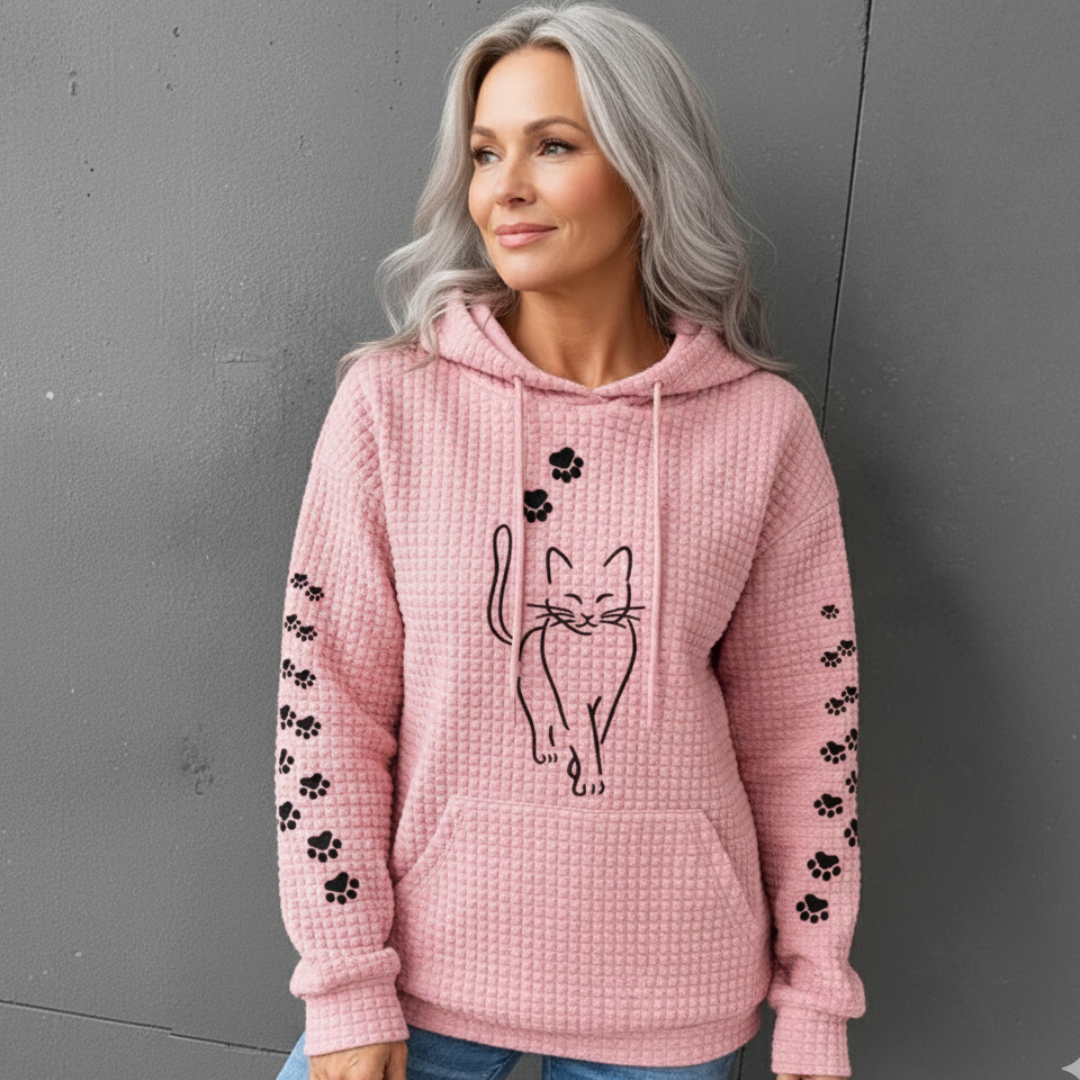 Close-up of the soft texture on a women's warm pullover hoodie, highlighting its comfort