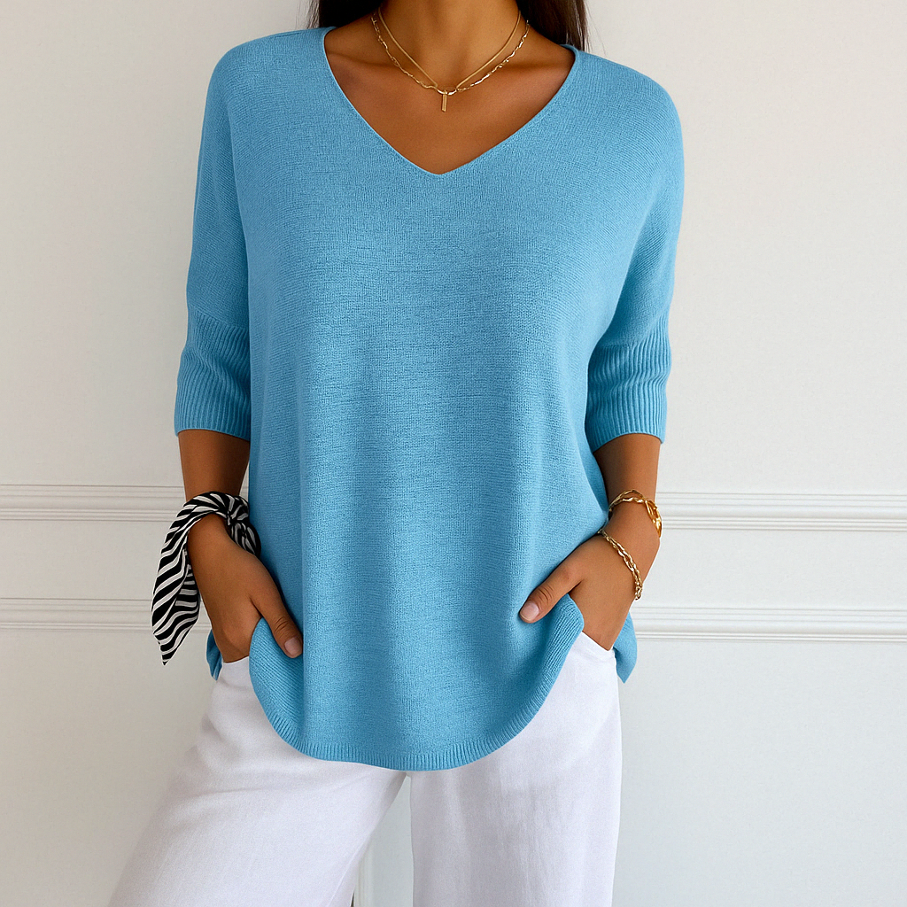 Back view of women's v-neck short sleeve lightweight knit sweater, perfect for summer casual