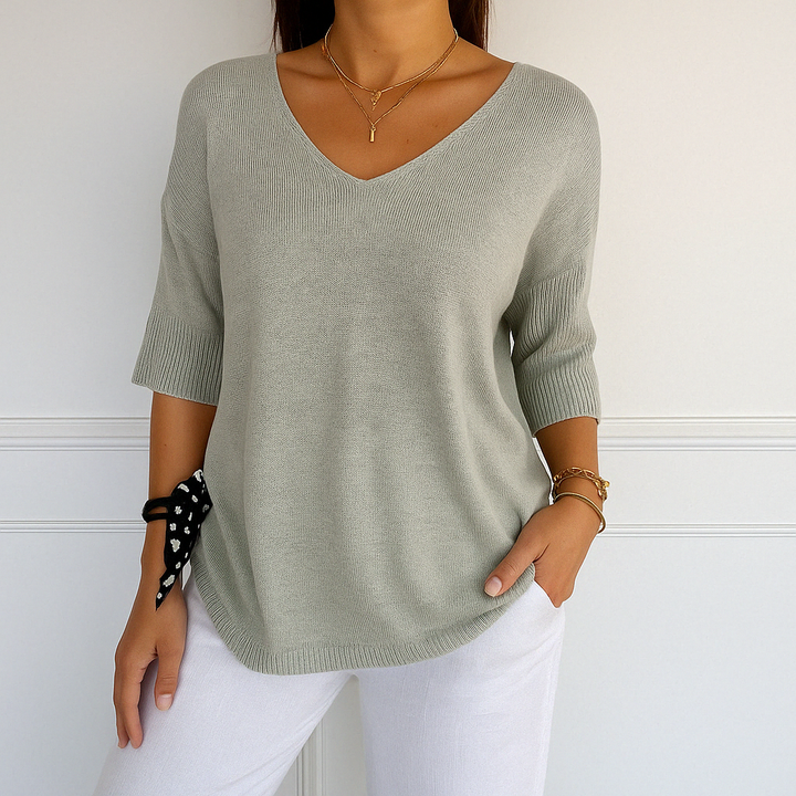 Casual women's blue v-neck short sleeve knit top, ideal lightweight sweater for warm weather