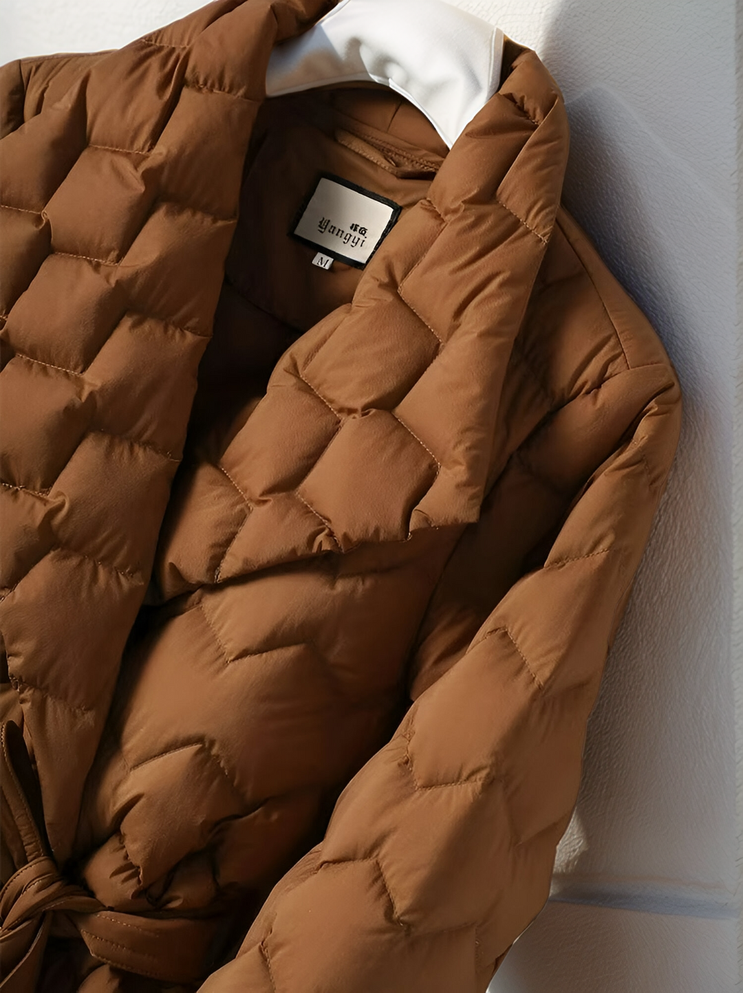 Warm women's long-sleeve padded jacket, ideal chic outerwear for winter.