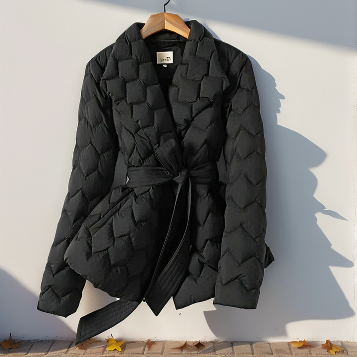 Stylish women's padded winter jacket, warm outerwear with an elegant belted design.