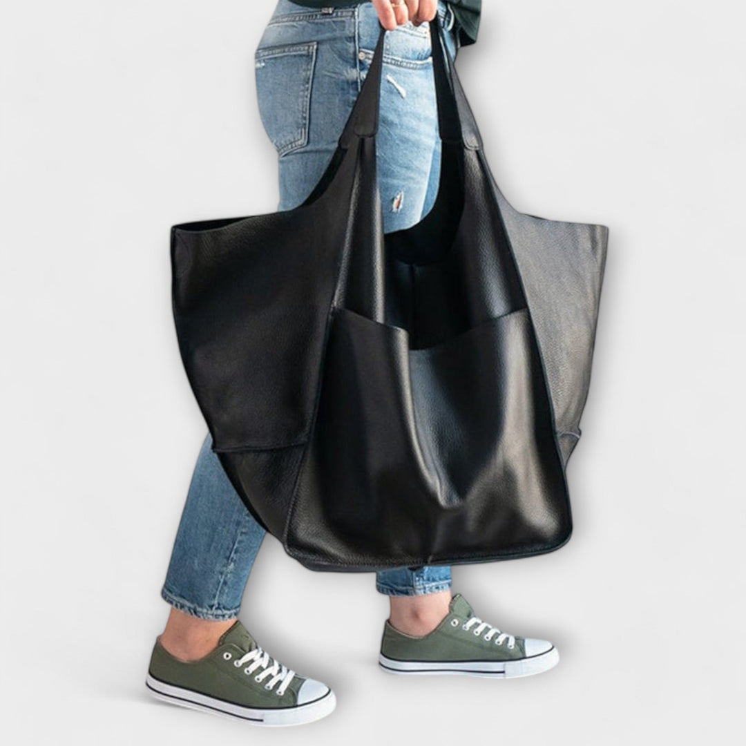 Close-up of the secure closure mechanism on a women's casual shoulder bag, for peace of mind.