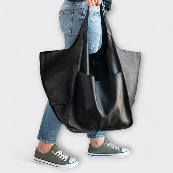 Close-up of the secure closure mechanism on a women's casual shoulder bag, for peace of mind.