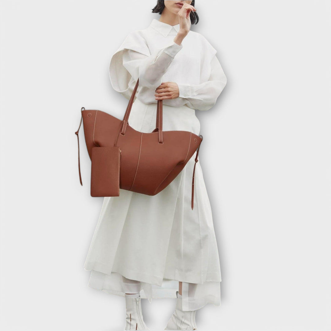 Travel-friendly women's faux leather tote bag, ample space for weekend getaways.