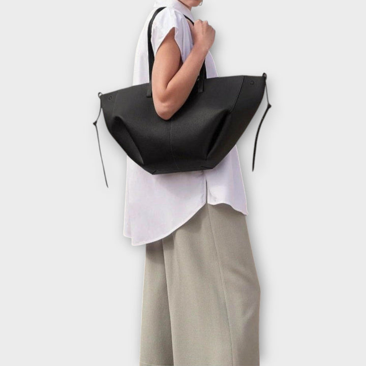 Spacious women's shoulder bag, designed for comfort and capacity, in a neutral color.