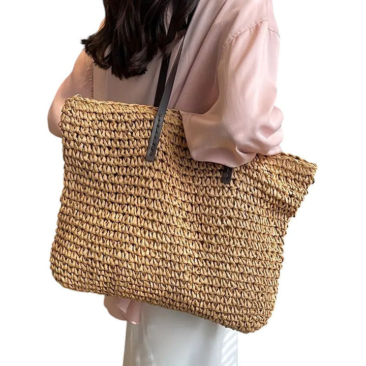 Large woven tote bag for women, designed for summer beach outings and casual wear.