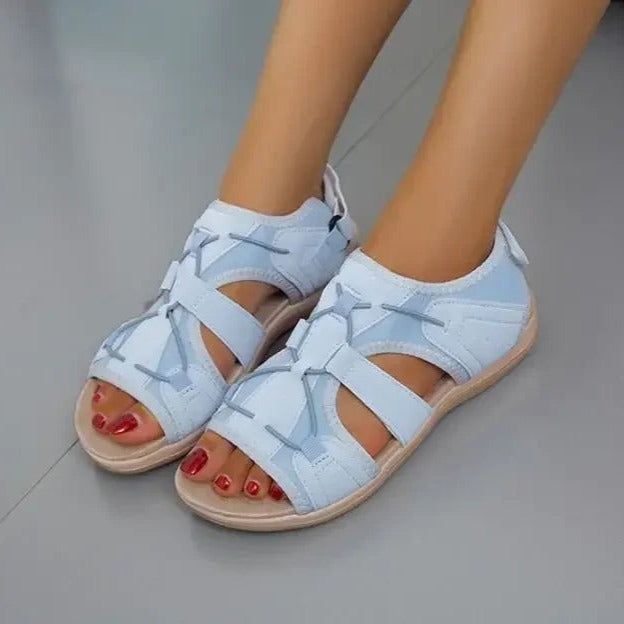 Pair of black women's athletic sandals, shown from the side, perfect for beach & outdoor
