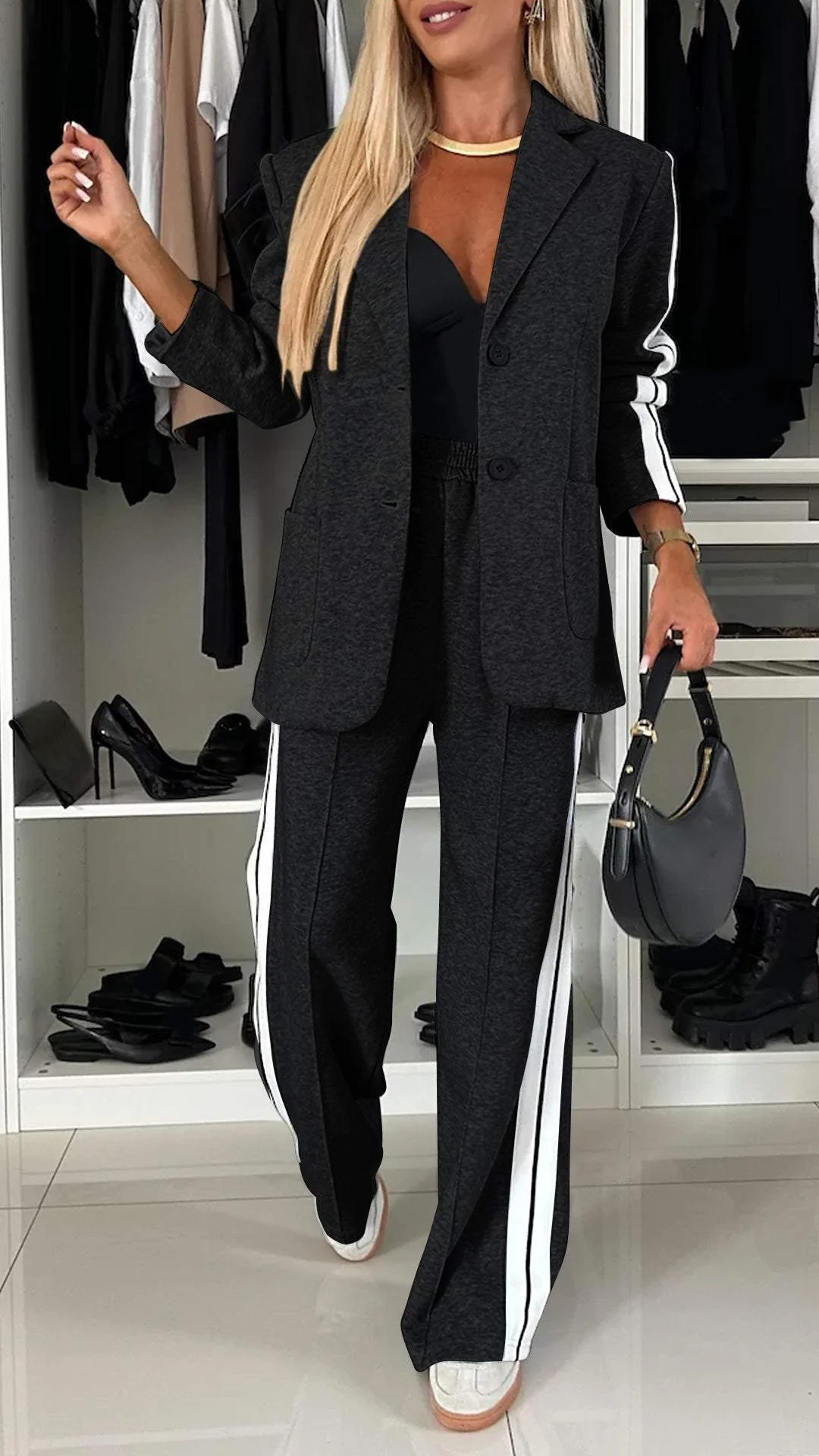 Versatile women's two-piece suit: sporty chic blazer & striped trousers, ideal for office or leisure wear.