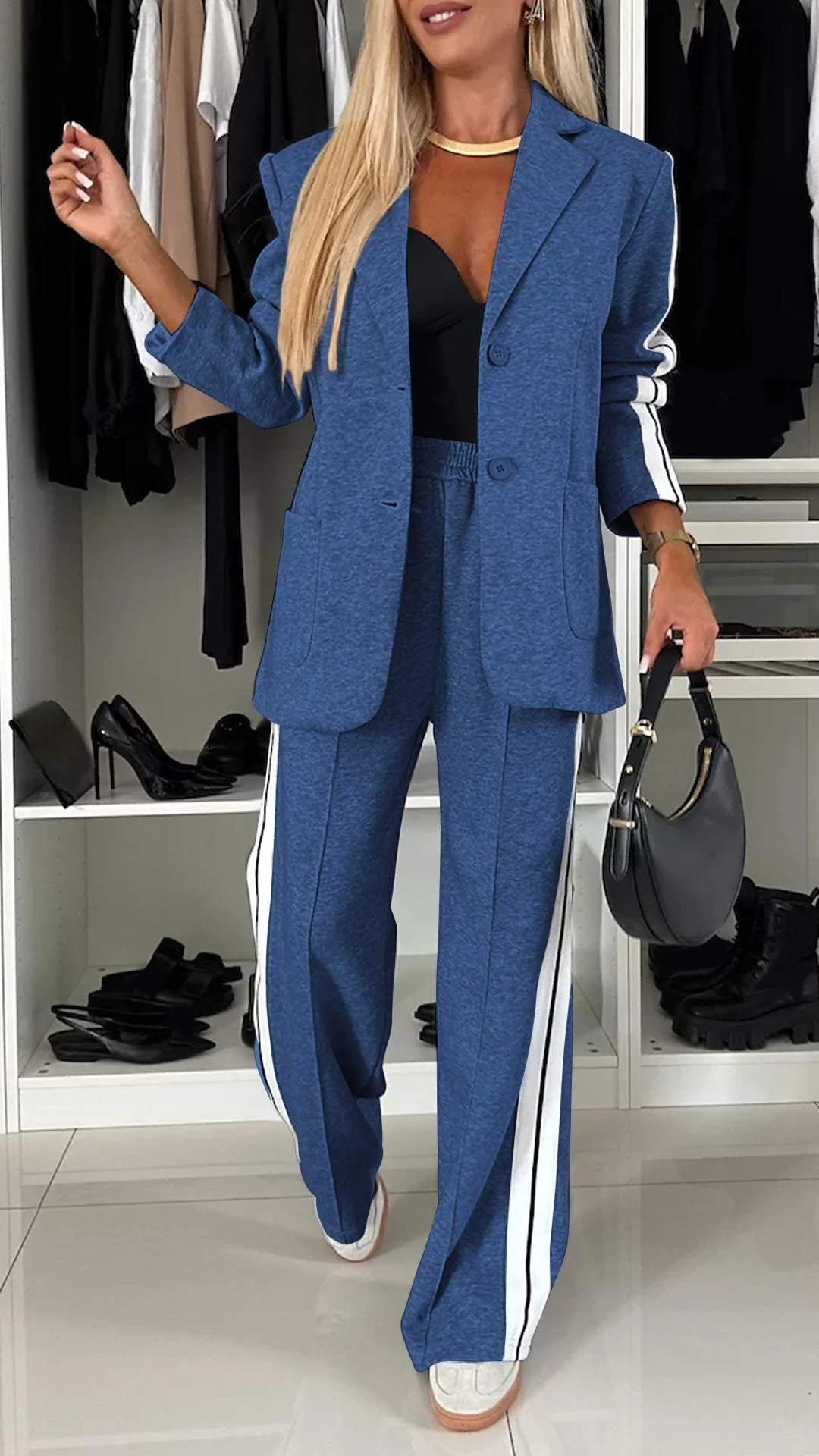 Urban luxe women's two-piece suit: a sophisticated blazer & striped trousers for a sporty chic, modern ensemble.