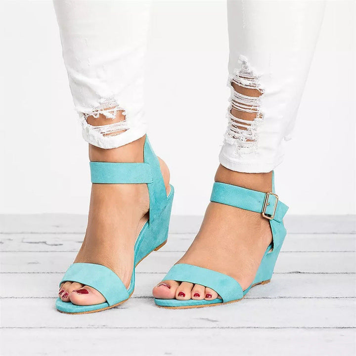 Chic women's spring wedge sandals, featuring a stylish ankle strap, ideal for warm weather fashion
