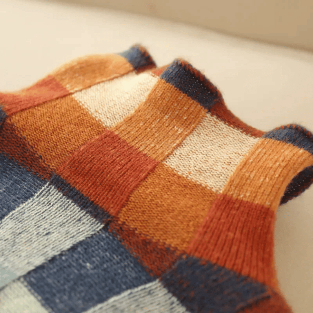 Relaxed fit knit women's sweater with colorful check and cozy turtleneck