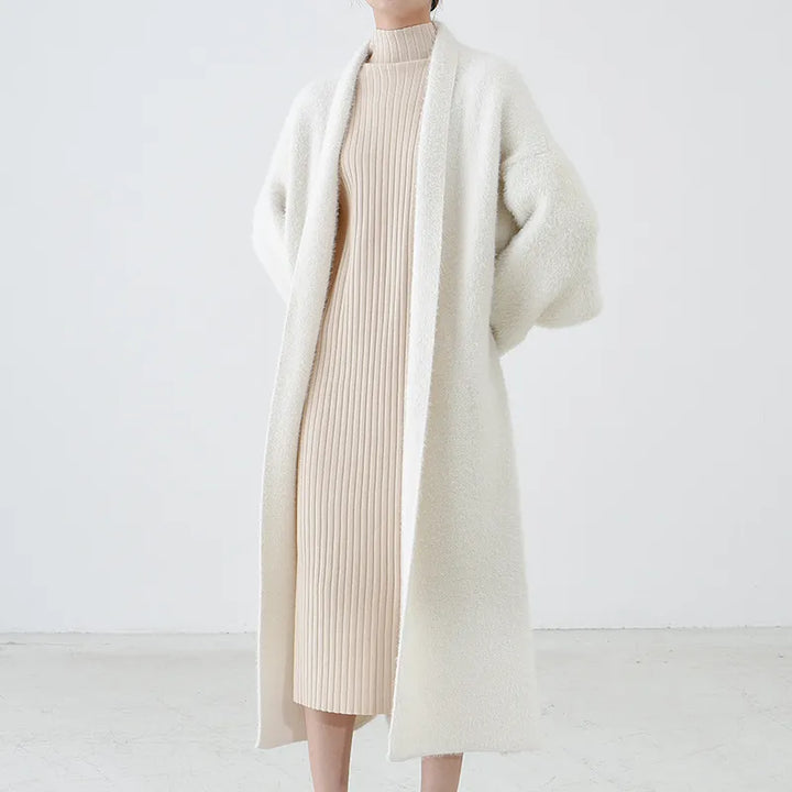 Women's spring longline open cardigan in a soft knit, perfect for elegant layering.