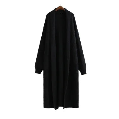 Stylish women's longline open cardigan, a key spring fashion layering piece.
