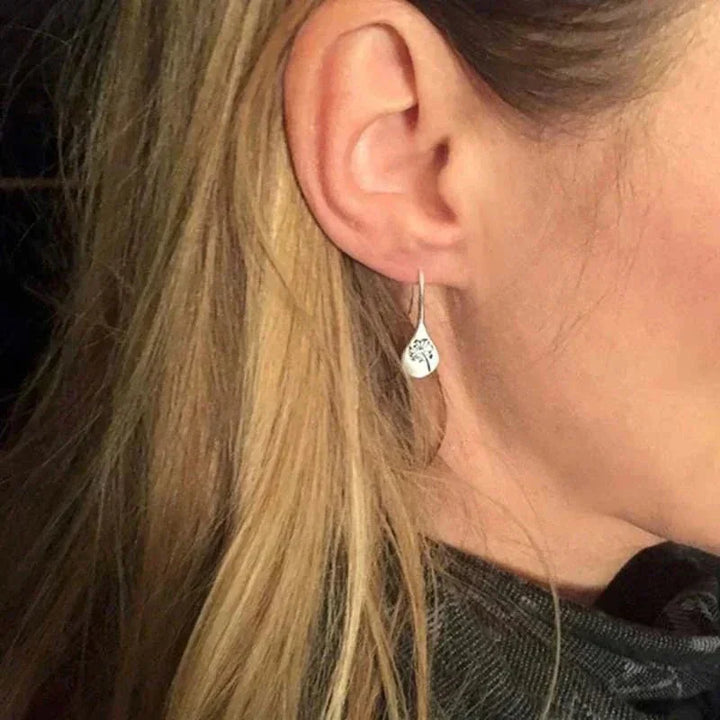 Sterling silver teardrop dangle earrings for women with real dandelion seeds. Beautiful nature-inspired hook jewelry.